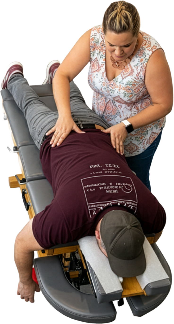 Dr. Karen performing a chiropractic adjustment on a patient Hands-on, precise